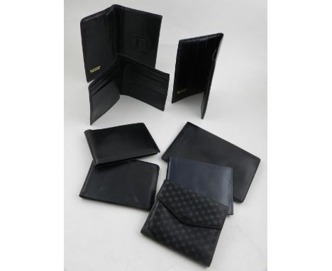 Celine, Paris. A ladies wallet, together with seven various black leather wallets.