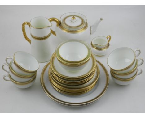 A late 19th / early 20th century Cauldon tea service, having reticulated gilt border.