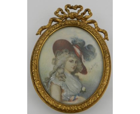 Late 19th century English school, an oval miniature portrait of a Georgian lady, watercolour on ivory, bears label to verso i