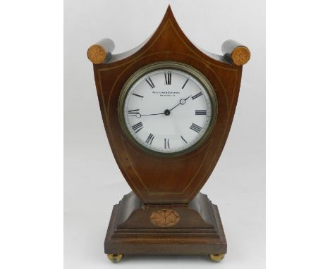 An Edwardian mantle clock, by Ollivant & Botsford of Manchester, having marquetry inlay. H.28cm