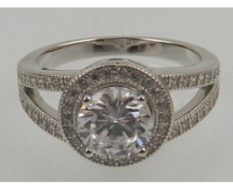 A silver and cubic zirconia set cluster ring. 