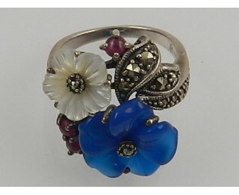 A silver and marcasite cocktail ring, decorated with hardstone flowers. 
