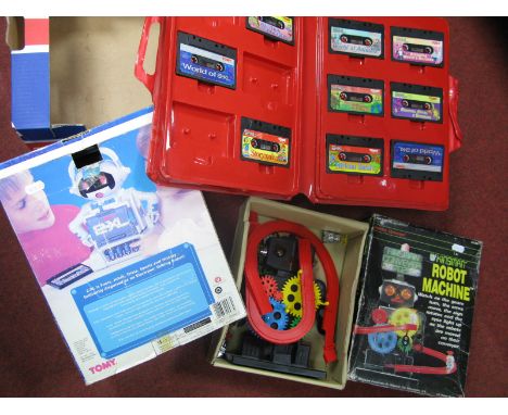 An Early 1990's Boxed Tomy 2-XL Plastic Electronic Toy "Talking" Robot, complete with carry case and nine 2-XL cassette tapes