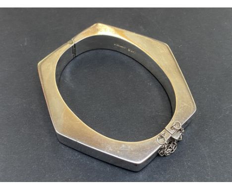 Heavy silver block bangle with safety chain 