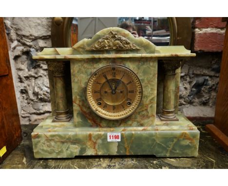 An Ansonia green onyx mantel clock,&nbsp;31cm high x 40cm wide, with pendulum.&nbsp; 