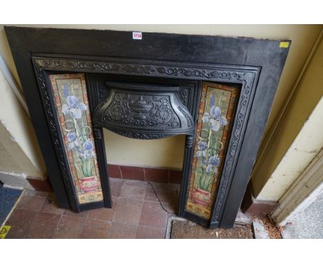 A cast iron and pottery tile fire insert,&nbsp;98.5 x 101cm.&nbsp; 