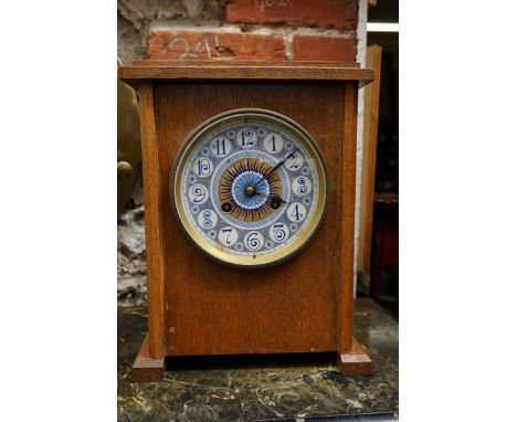 A late 19th century Aesthetic oak mantel clock,&nbsp;attributed to Lewis Foreman Day, with painted 6in ceramic dial and gong 