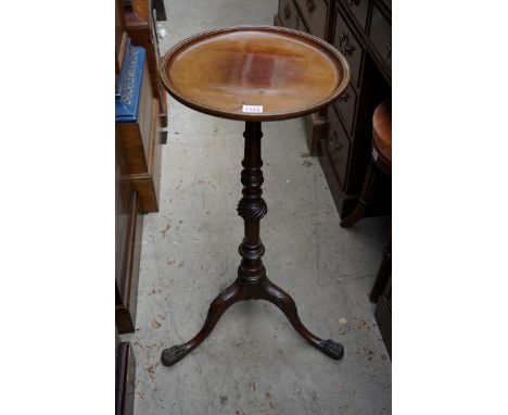 An antique carved mahogany tripod wine table,&nbsp;with dished top, 33.5cm diameter; together with an antique mahogany pie cr