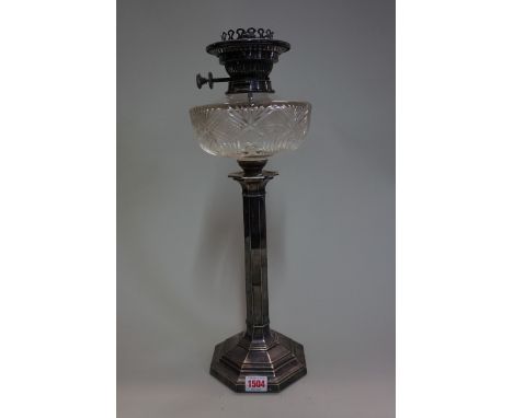 An electroplate oil lamp,&nbsp;with cut glass reservoir, 49cm high.&nbsp; 