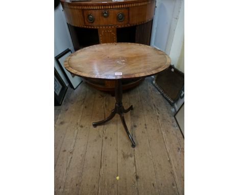 A late 18th century mahogany and rosewood crossbanded oval tilt top tripod table,&nbsp;61cm wide.&nbsp; 