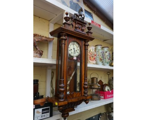 A walnut Vienna style wall clock,&nbsp;99cm high, with pendulum.&nbsp; 