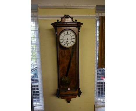 A late 19th century burr walnut and ebonized Vienna style wall clock,&nbsp;with enamel dial and weight driven movement, 112cm