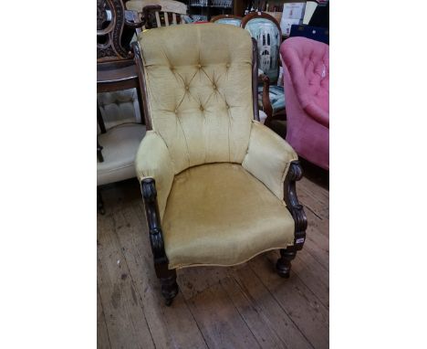 A Victorian carved rosewood and button upholstered occasional armchair.&nbsp; 