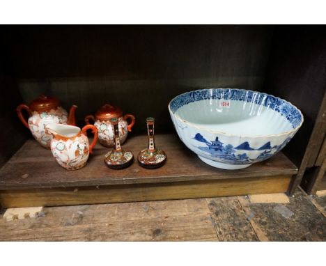 A Chinese blue and white bowl,&nbsp;19th century, painted with a continuous scene, 29cm diameter, (hairlines); together with 