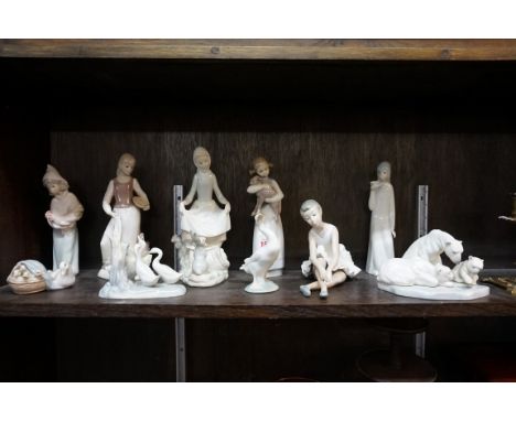 Six Lladro figures,&nbsp;largest 23cm high; together with two Nao figures; and two others. (10) 