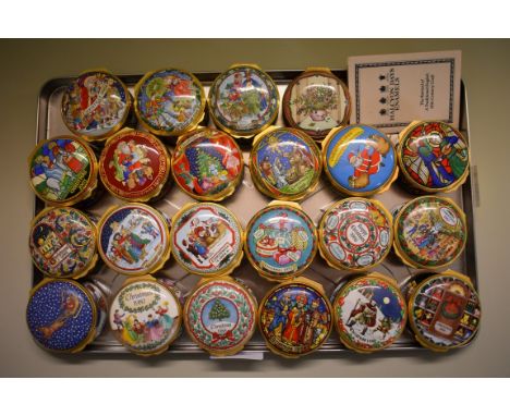 A collection of twenty-one Halcyon Days enamel Christmas boxes, comprising 1986-2006 inclusive; and another Halcyon Days enam