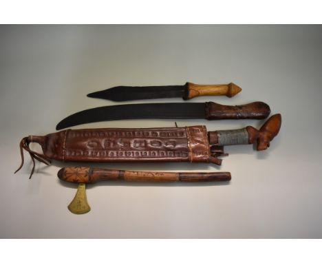 A machete, having 36cm blade signed Wilson, Sheffield, in a tooled leather Tobago sheath; together with a knife having 16cm b