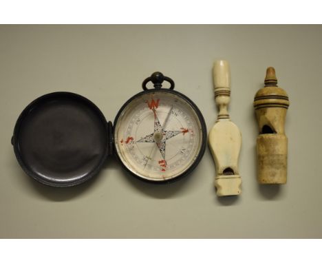 A&nbsp;World War I period brass pocket compass; together with two bone whistles. (3) 