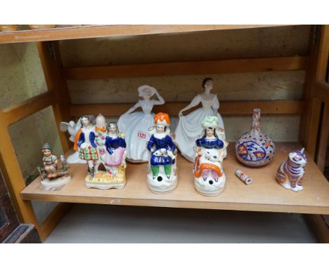 A mixed group of pottery and porcelain, comprising: three Victorian Staffordshire pottery figures; three Royal Doulton figure