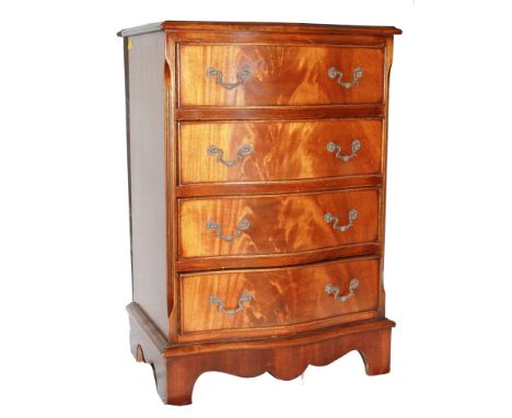 A smaller sized Georgian-style mahogany and cross banded serpentine fronted chest of four drawers with shaped top, brass drop