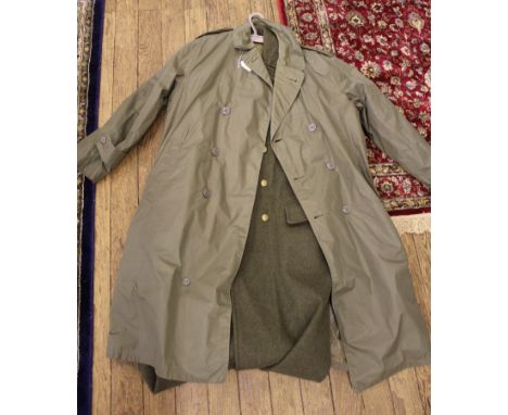 A Royal Marine taupe light raincoat and a heavy Royal Marine wool overcoat, reputed to have been worn on D Day 1944 at Juno b