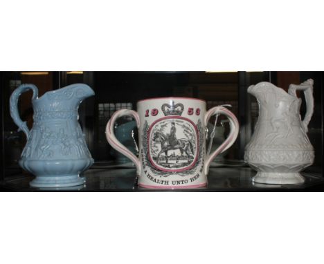 A pair of Rigdway Hanley Victorian jugs with allegorical scenes in relief and a Royal Doulton ceramic two handled Coronation 