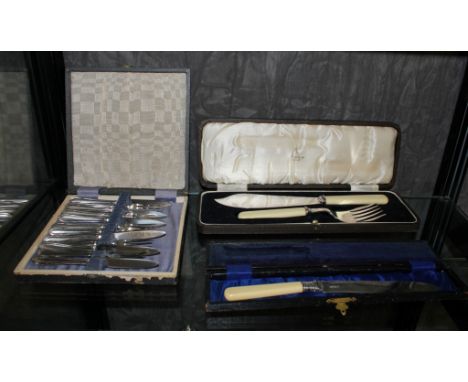 A set of six silver plated tea knives and forks in presentation case, a fish service in presentation case and a bread knife i