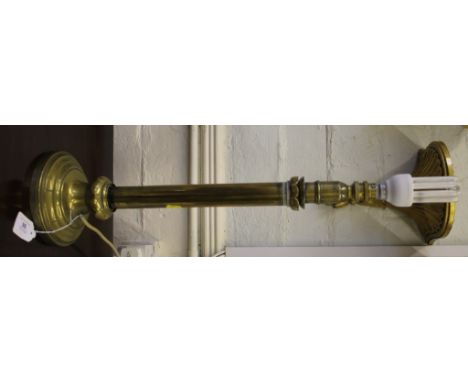 A William IV-style brass candlestick converted to electricity with lotus leaf decoration on a circular base, 50cm high