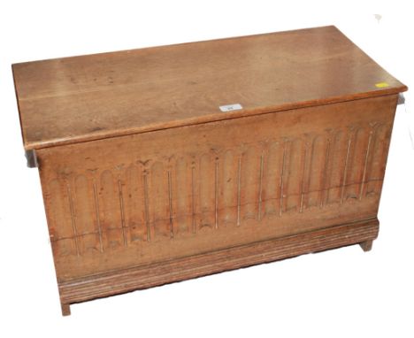 A 19th century beech wood oblong storage trunk or bible box with lift up lid, arcading to the front on a shaped base and tres