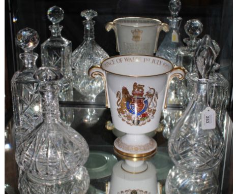 An assortment of four cut crystal decanters, two square based and two baluster shaped and a Spode limited edition ice bucket 