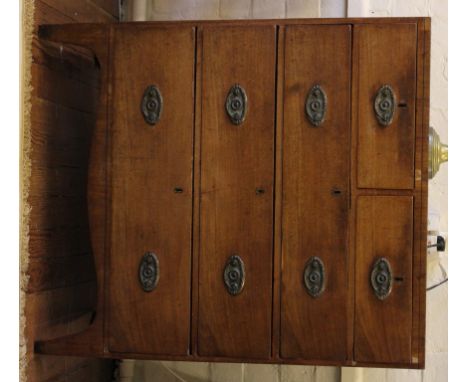A Georgian mahogany and cross banded chest of two short and three graduated drawers with overall ebony inlay, oval brass back