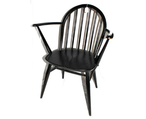 A vintage Ercol lacquered kitchen armchair with hooped back and arms, spindle supports, dished seat, raised on turned legs