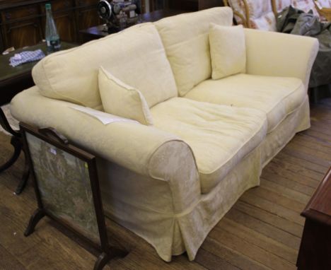 A contemporary drawing room sofa with cream coloured fabric upholstery, 200cm wide