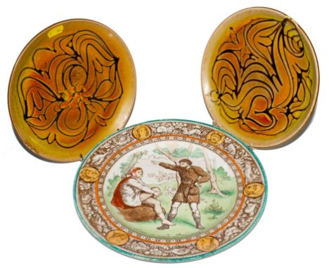 A pair of Poole Pottery circular dishes with abstract design and an early 20th century Wedgwood 'Ivanhoe' plate with inscript