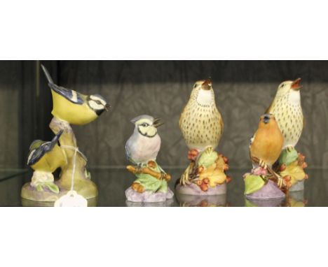 A selection of Royal Worcester hand painted figurines of birds on stylised bases