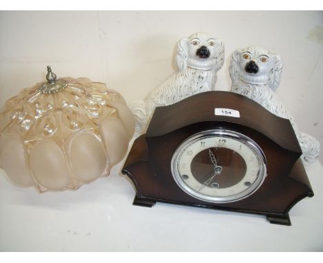 Mantel clock, glass centre light shade and a pair of Staffordshire seated Spaniels 
