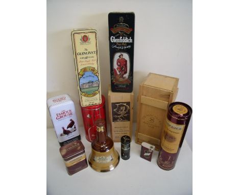 Box containing a selection of various tins and packing cases for Whiskey, spirits etc including a Bells Old Scotch Whisky Wad