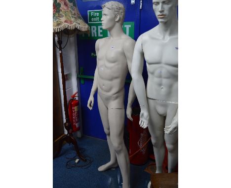 A FULL LENGTH MALE SHOP DISPLAY MANNEQUIN, on a seperate glass stand, approximate height 182cm