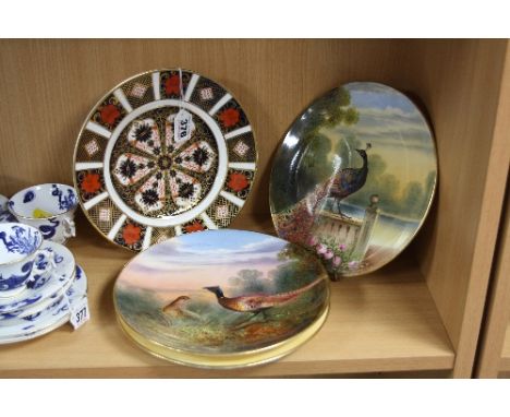 A ROYAL CROWN DERBY IMARI PLATE, '1128' pattern (seconds), diameter 22cm, a pair of bird decorated plates signed W Birbeck an