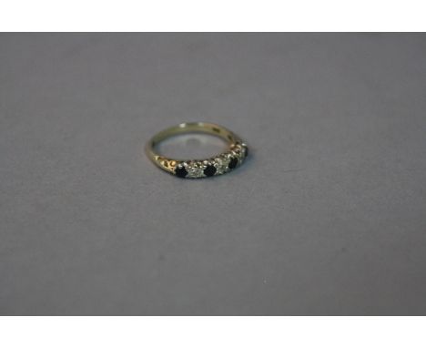 A LATE 20TH CENTURY SAPPHIRE AND DIAMOND HALF ETERNITY RING, estimated total diamond weight 0.03ct, ring size M, hallmarked 9