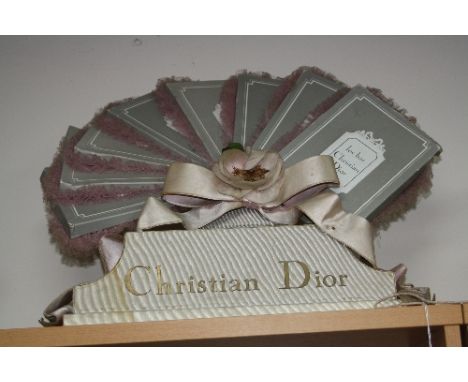 A CHRISTIAN DIOR SHOP DISPLAY  ADVERTISING STAND, 'Les Bas Christian Dior', with fabric bow, height approximately 46cm x leng