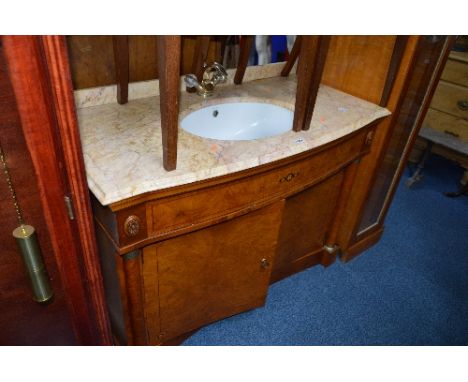 A BURR WALNUT FINISH WASH BASIN, with marble top, sink and brass tap above a double cupboard base, approximate size width 123
