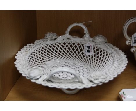 A FRETWORK CERAMIC BASKET, florally encrusted, diameter approximately 27.5cm (chips to edges)