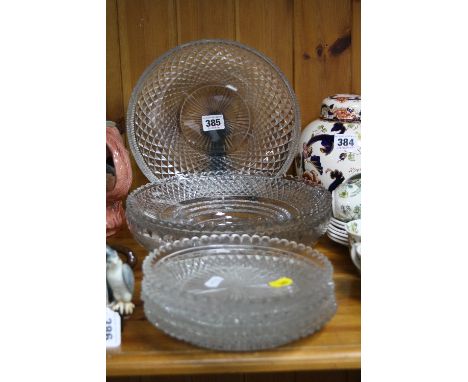 THREE 19TH CENTURY CUT GLASS EPERGNE CENTREPIECE DISHES, together with a set of four cut glass saucers with wavy rims (7)