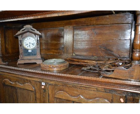 AN OAK ROPE EDGED ANEROID BAROMETER, a mantle clock, carpet beaters etc (6)