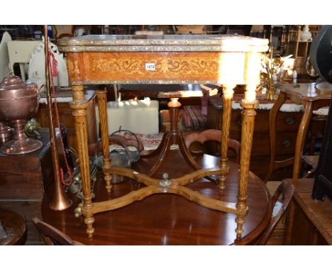 A FRENCH WALNUT FOLD OVER CARD TABLE WITH LEATHER INSET, gilt banding above four fluted legs united by stretcher with brass f