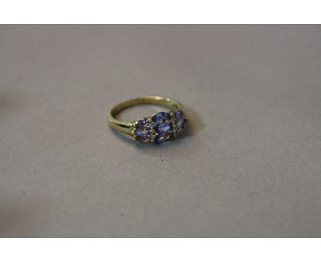 A 9CT TANZANITE AND DIAMOND MARCASITE CLUSTER RING, ring size Q, approximate weight 2.6 grams