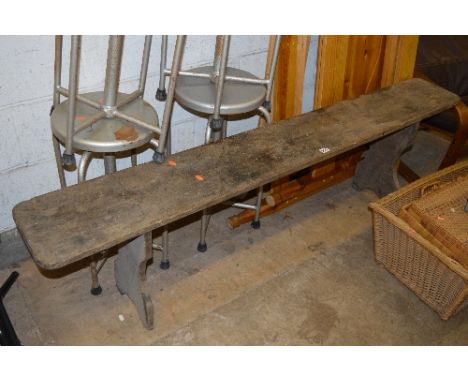 A VINTAGE WOODEN TRESTLE STYLE BENCH
