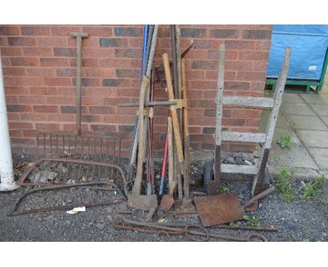 A QUANTITY OF VINTAGE GARDEN TOOLS, including a hay rack and a sack truck etc