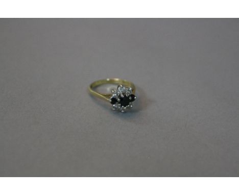 AN 18CT SAPPHIRE AND DIAMOND CLUSTER RING, ring size I, approximate weight 3.2 grams